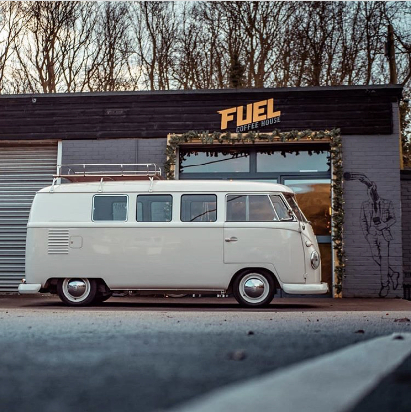 Picture of camper van outside a cafe.